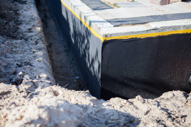 Professional Waterproofing technician working in Little River, AL